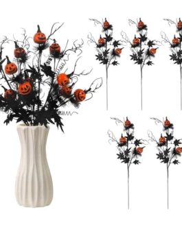 Fleurs d&eacute;coratives noir et orange avec citrouilles sculpt&eacute;es, bouquet d'Halloween dans vase blanc.
